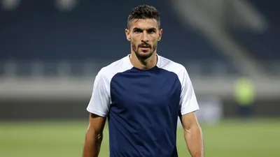Mid-30s, muscular Dinamo Zagreb midfielder, dark hair, determined expression, waist-up shot