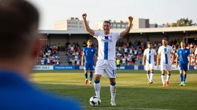 A photo of Željko Sopić celebrating with Dinamo players and staff after the win over Ki Klaksvik, with a triumphant...