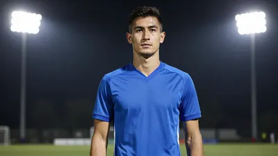 A 30-year-old male football player, waist-up, wearing a solid blue jersey