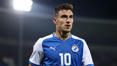 A photorealistic image of an anonymous Dinamo Zagreb player, aged 20-25, wearing a blue jersey with white sleeves and a...